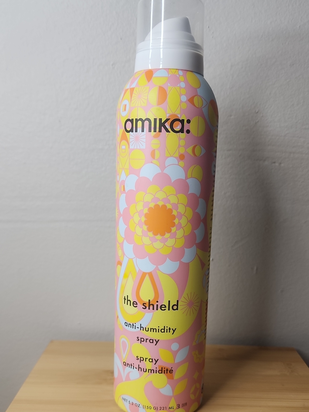 amika Anti-Humidity Shield Spray — Pink & Yellow Bottle